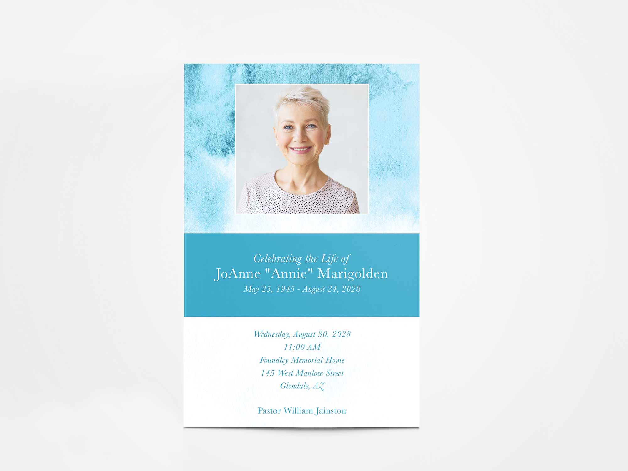 Soft watercolor brush strokes in teal hues.